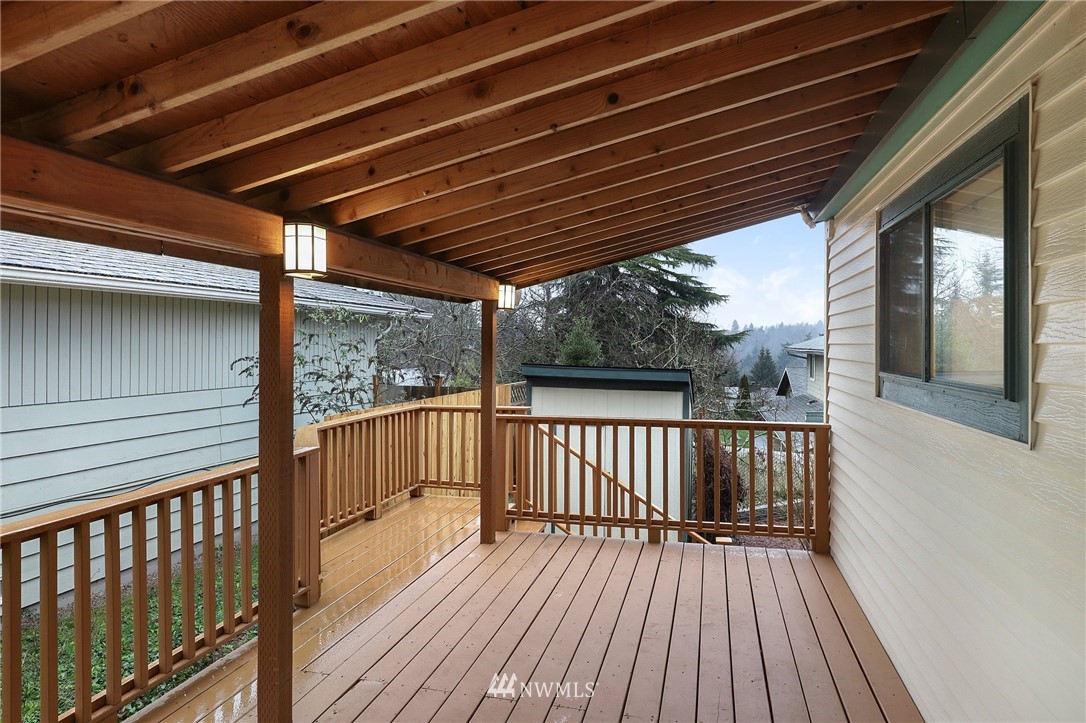 617 Reiten Road Kent, WA 98030 - Photo 22 of 30 a view of deck with wooden floor and iron stairs
