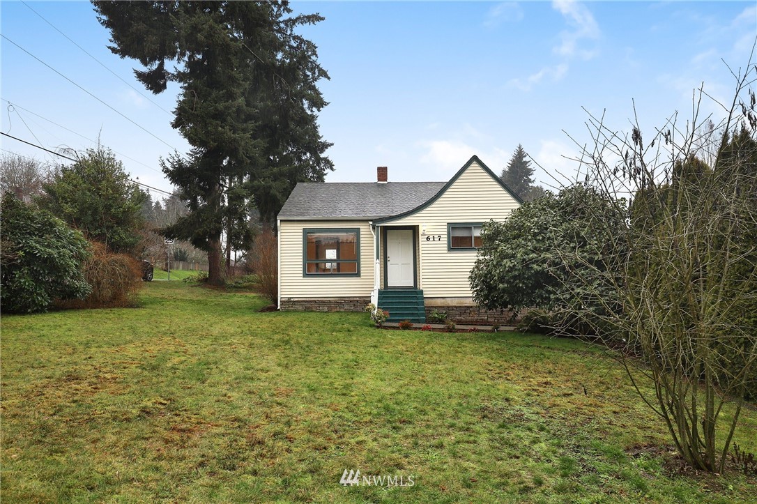 617 Reiten Road Kent, WA 98030 - Photo 27 of 30 a front view of a house with a yard and trees