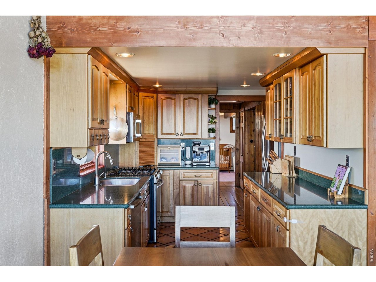 393 Dixon Road Boulder, CO 80302 - Photo 10 of 50 Kitchen w/ gas range and stainless appliances