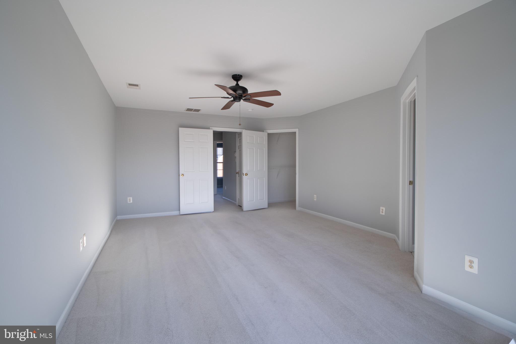98 Lullwater Way Falling Waters, WV 25419 - Photo 22 of 43 a view of an empty room with a ceiling fan
