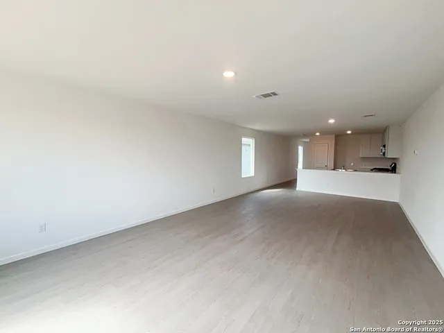 a view of a kitchen and a window