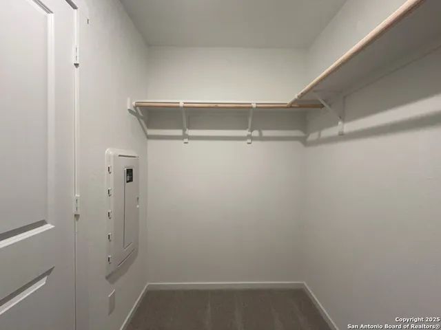 a view of an empty walk in closet