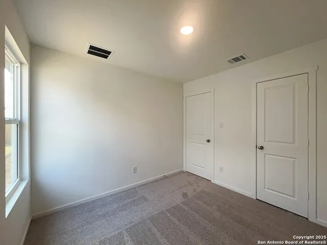 a view of a room with an empty space