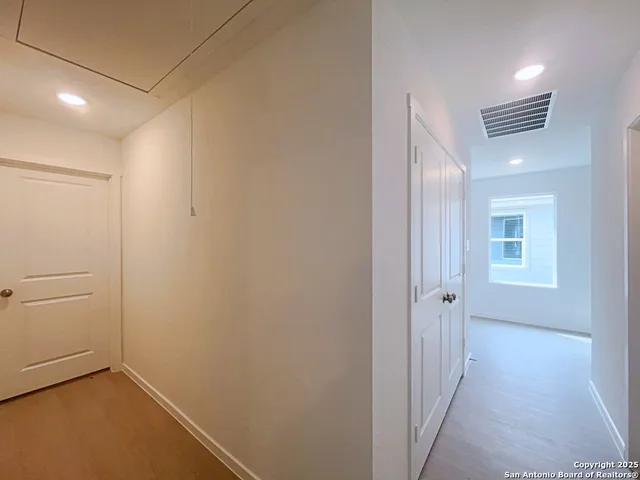 a view of a hallway with closet