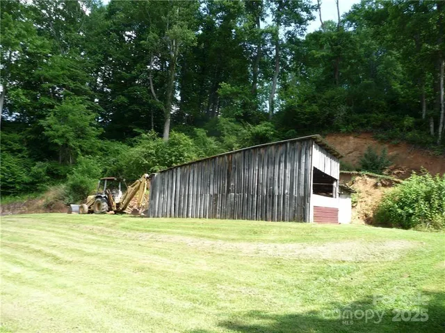 a house view with swimming pool in front of it
