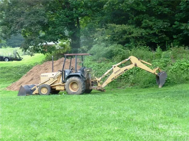 a view of backyard with a small deck