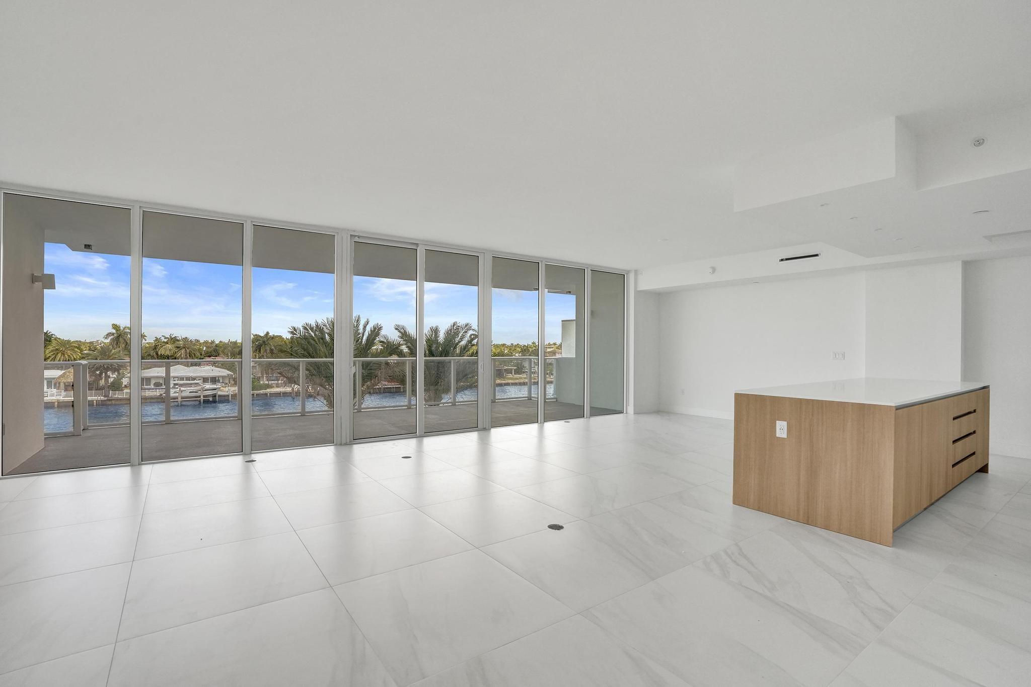 407 North Riverside Drive, Unit 303 Pompano Beach, FL 33062 - Photo 10 of 74 a view of an empty room with glass door