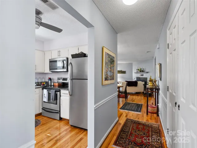 a kitchen with stainless steel appliances refrigerator stove microwave and cabinets