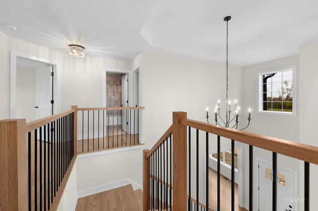 a view of a hallway view with staircase