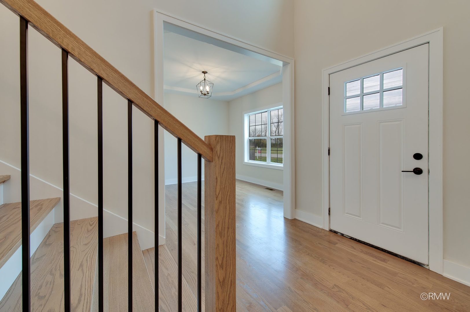 25-w275 Doris Avenue Carol Stream, IL 60188 - Photo 5 of 31 a view of an entryway with wooden floor and stairs