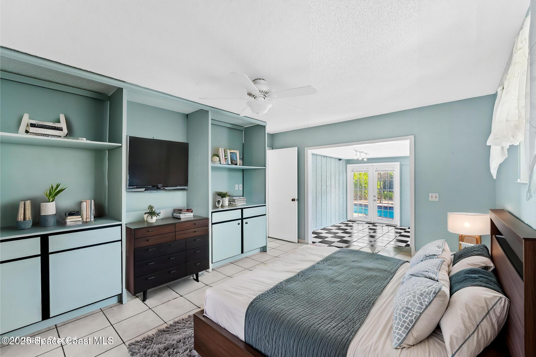 544 Solitaire Palm Drive Indialantic, FL 32903 - Photo 12 of 37 a bedroom with a bed and a flat screen tv