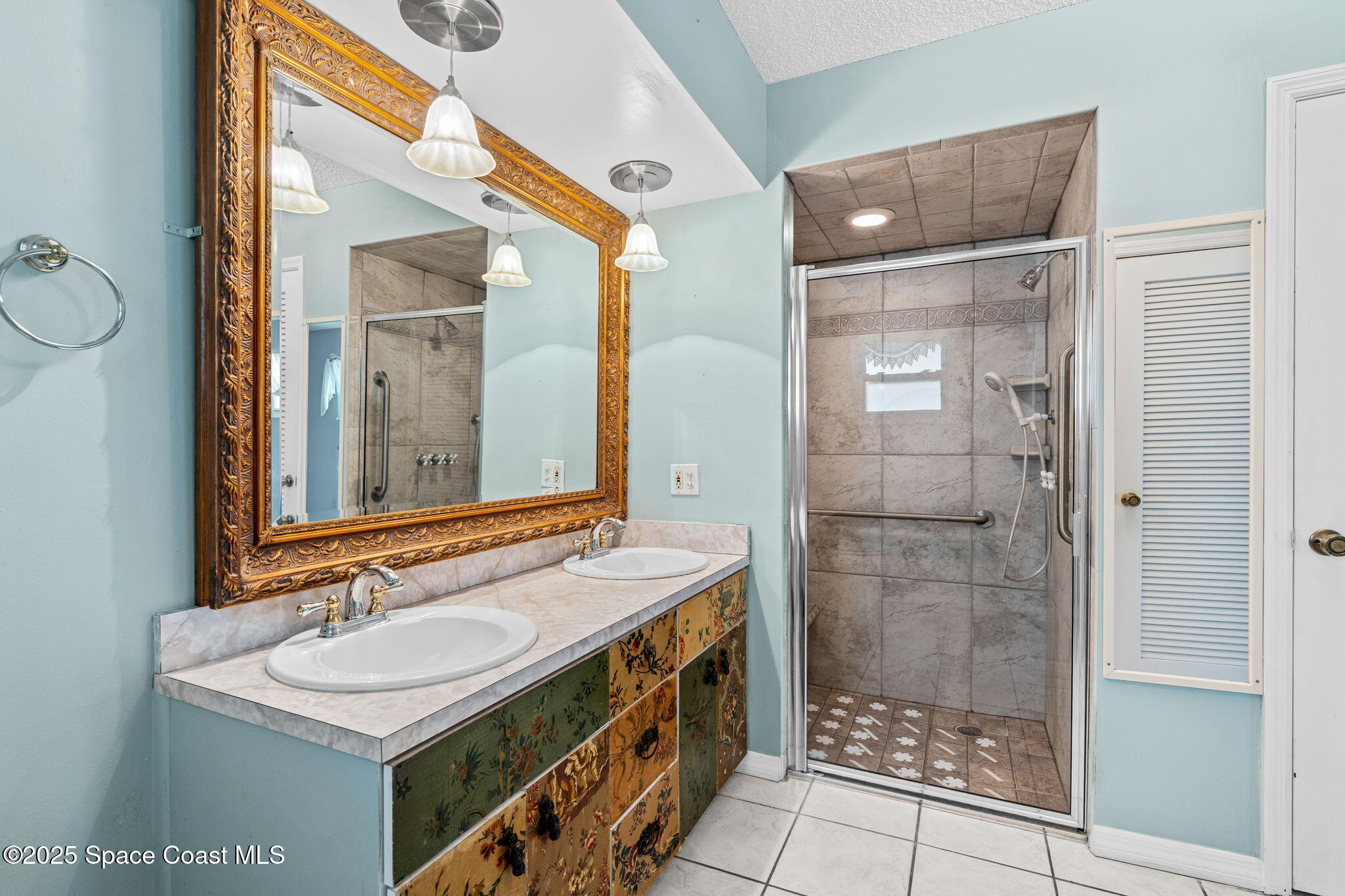 544 Solitaire Palm Drive Indialantic, FL 32903 - Photo 15 of 37 a bathroom with a sink a toilet and shower