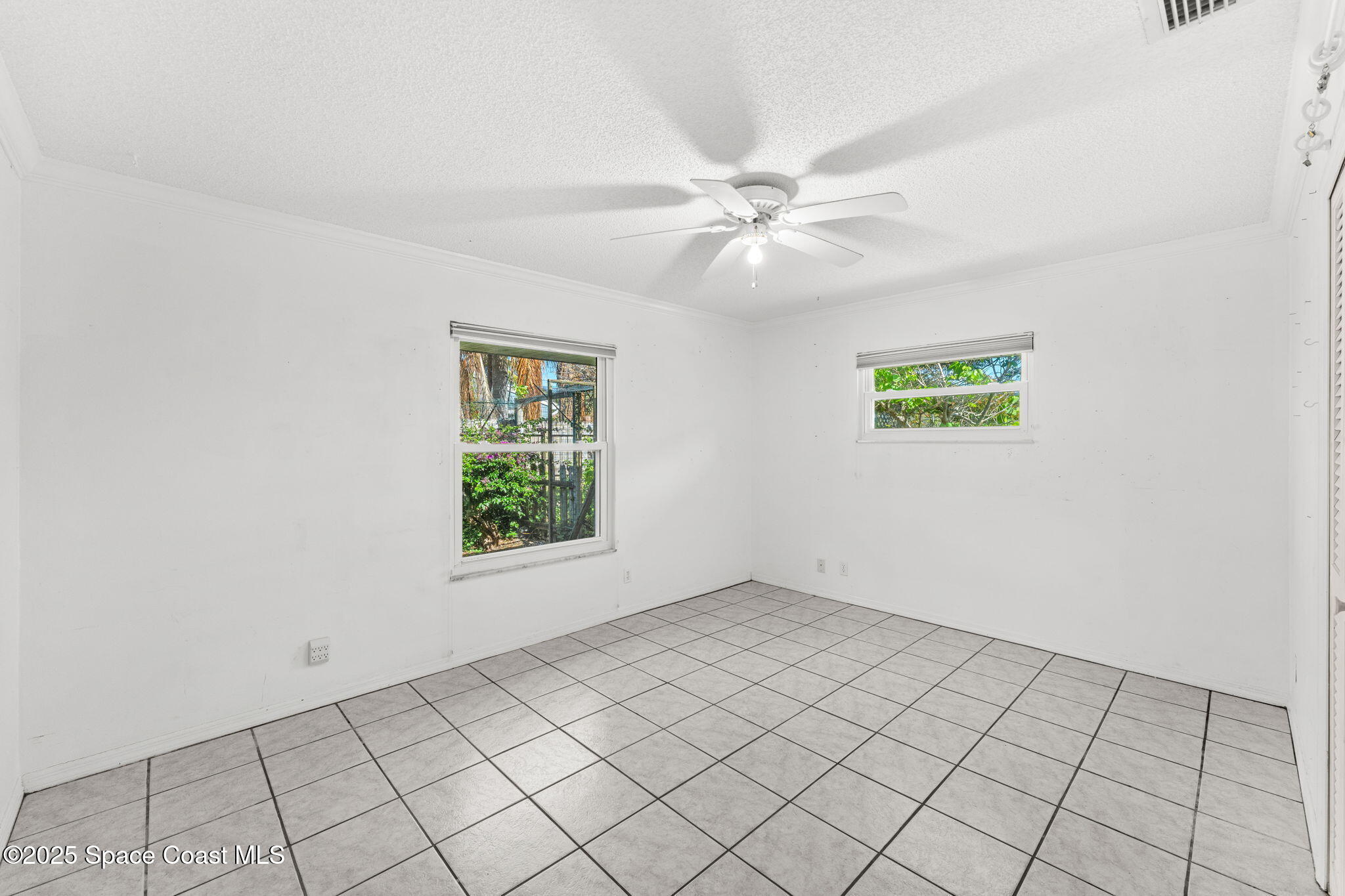 544 Solitaire Palm Drive Indialantic, FL 32903 - Photo 18 of 37 a view of an empty room and window