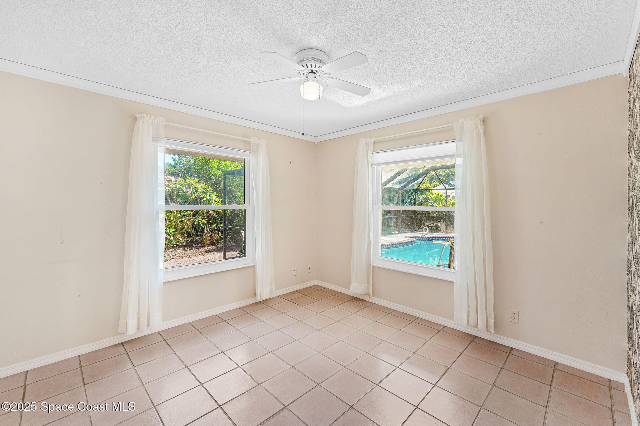 544 Solitaire Palm Drive Indialantic, FL 32903 - Photo 19 of 37 a view of an empty room with a window
