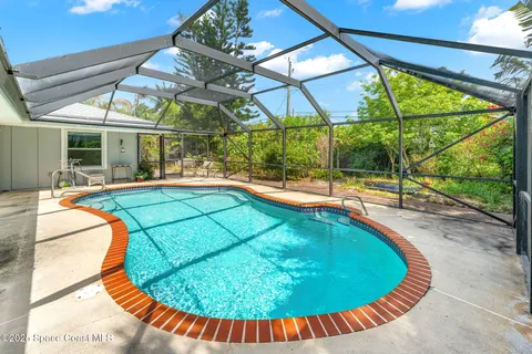 a view of a swimming pool with a patio