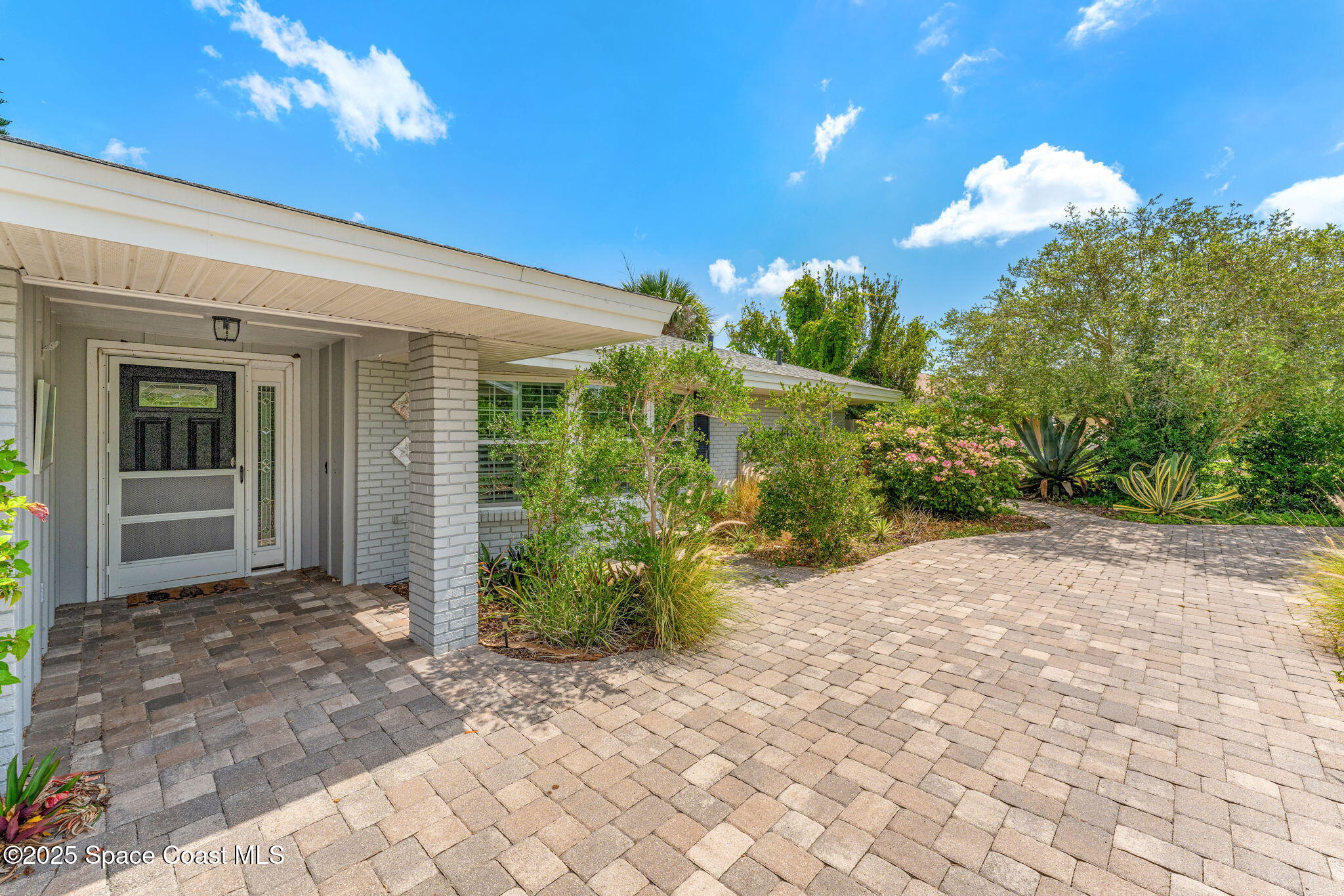 544 Solitaire Palm Drive Indialantic, FL 32903 - Photo 32 of 37 a view of a house with a backyard