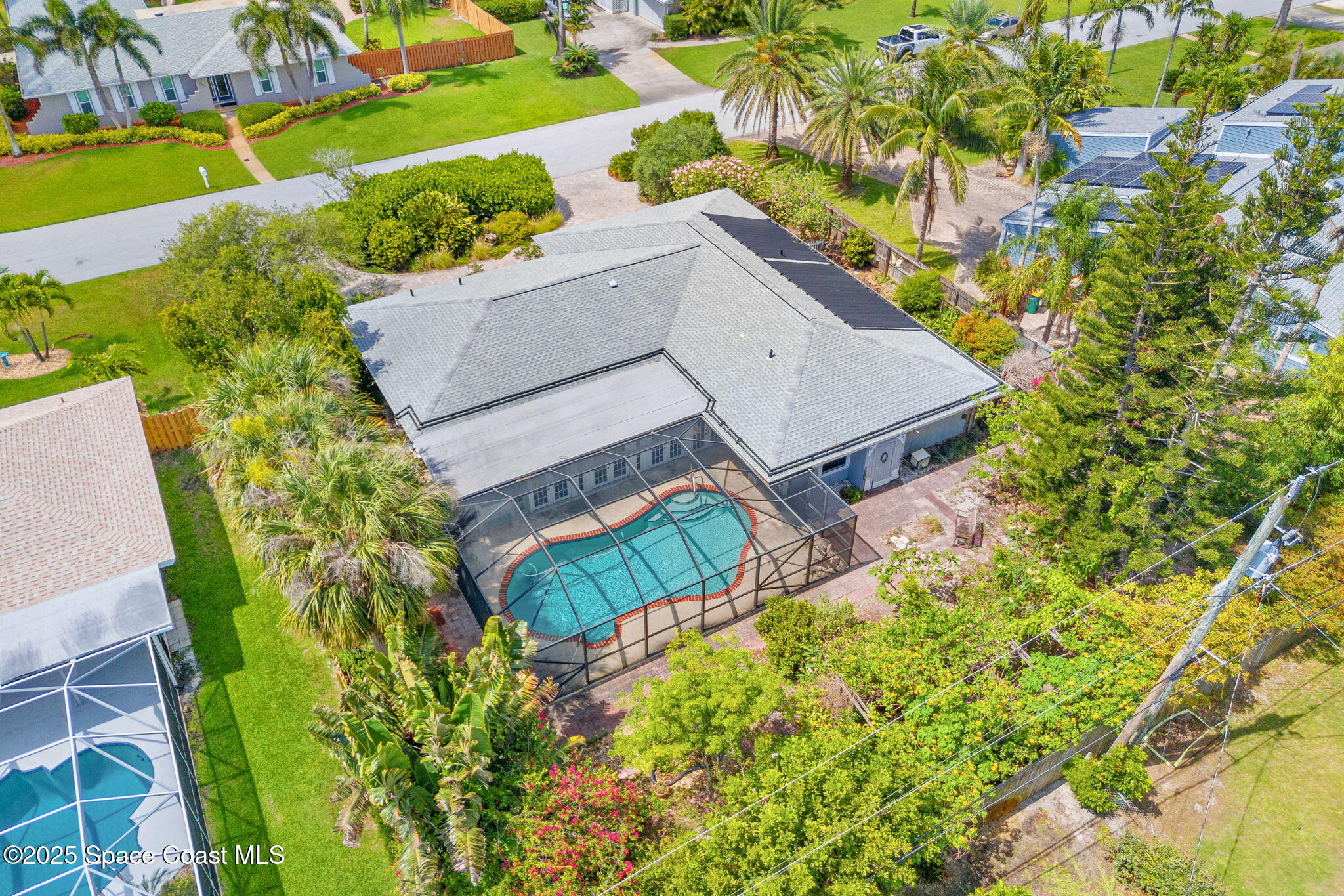 544 Solitaire Palm Drive Indialantic, FL 32903 - Photo 35 of 37 an aerial view of a house with a yard and swimming pool