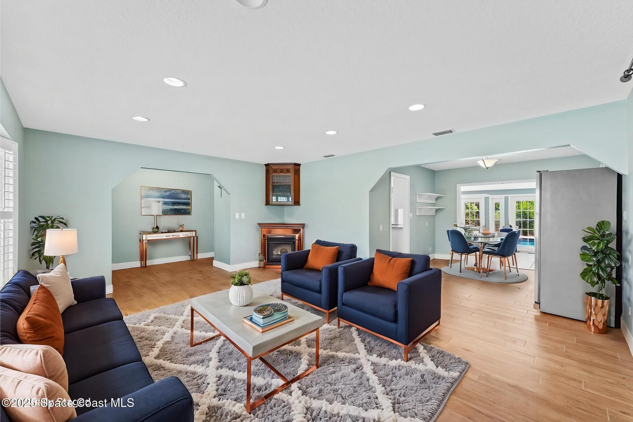 544 Solitaire Palm Drive Indialantic, FL 32903 - Photo 4 of 37 a living room with furniture and wooden floor