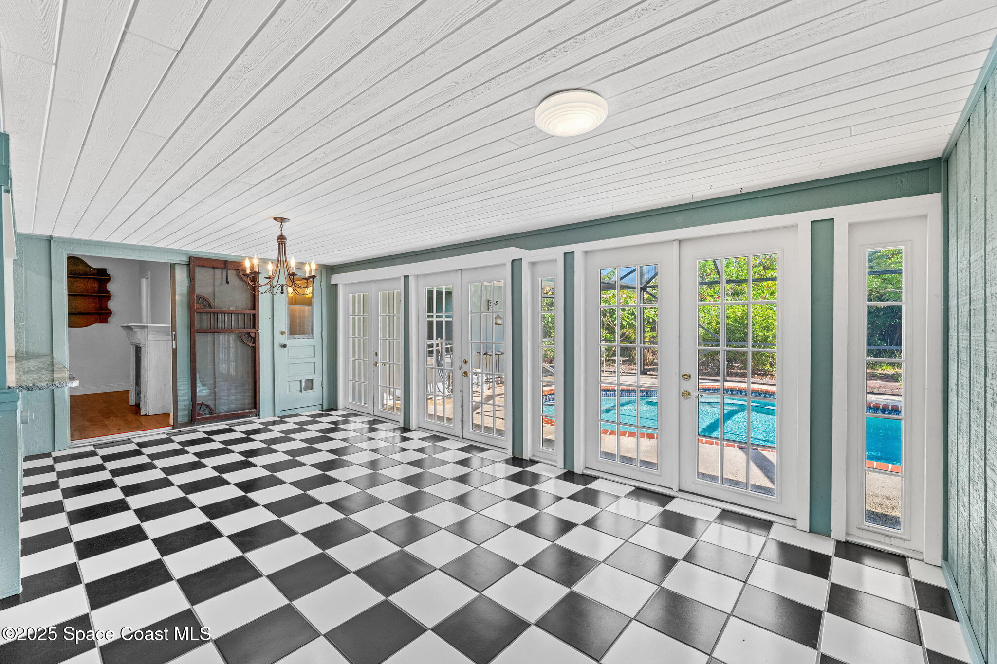 544 Solitaire Palm Drive Indialantic, FL 32903 - Photo 6 of 37 a building outdoor space with a black and white checkered floor