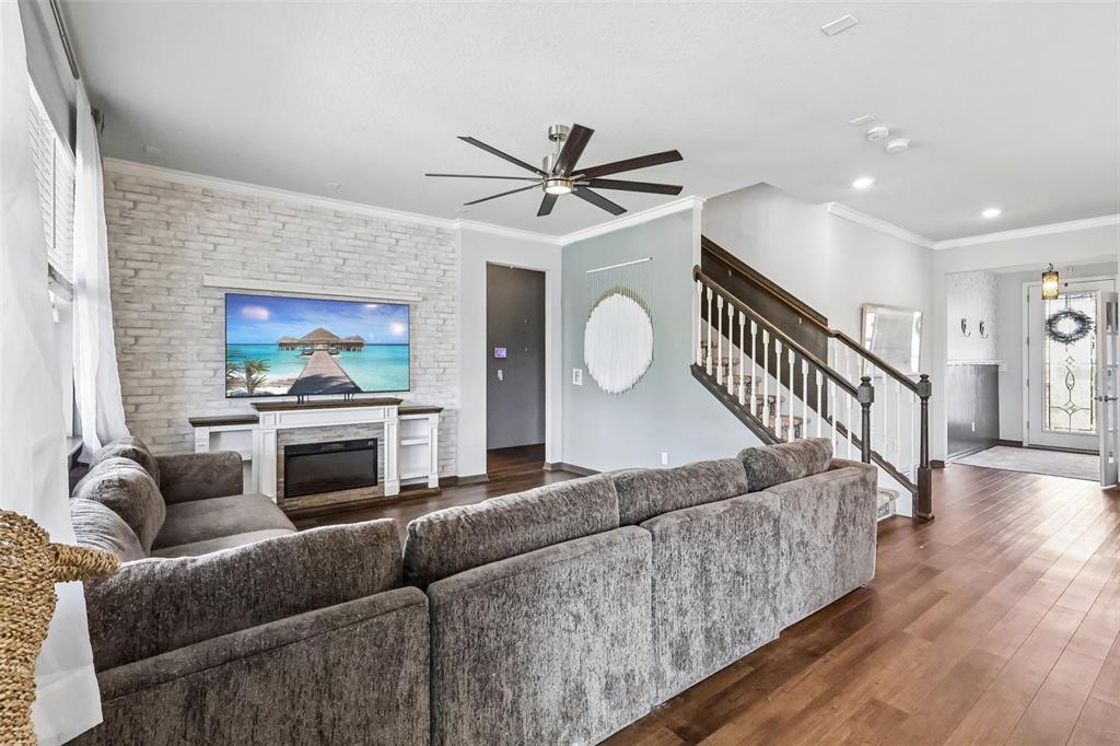 2575 Auburn Ridge Drive Apopka, FL 32712 - Photo 14 of 48 a living room with furniture and a chandelier