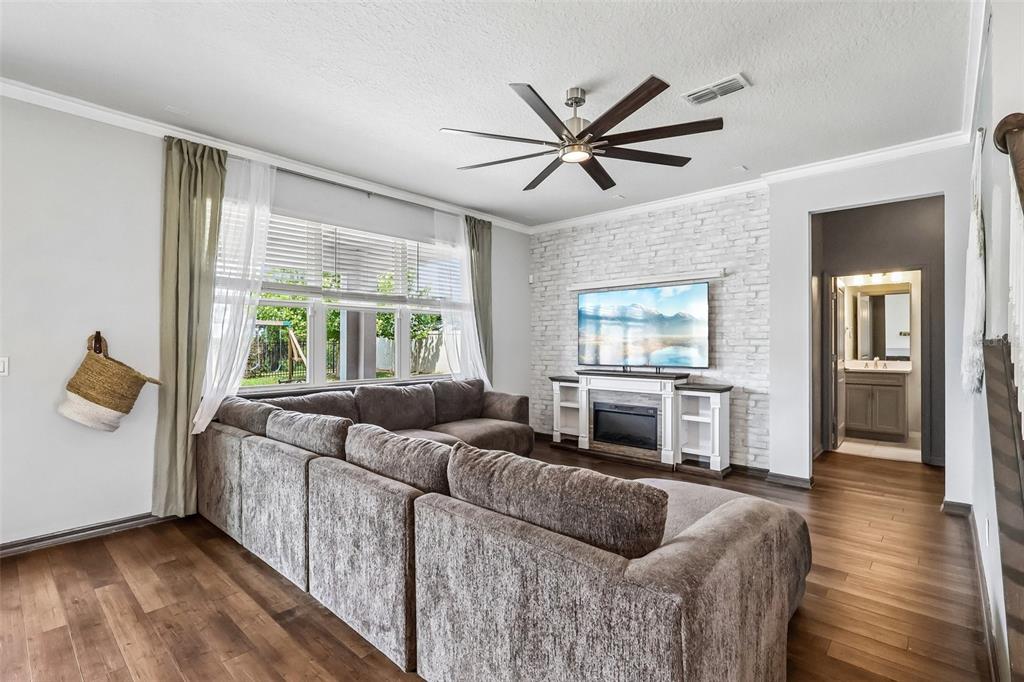 2575 Auburn Ridge Drive Apopka, FL 32712 - Photo 16 of 48 a living room with furniture and a window