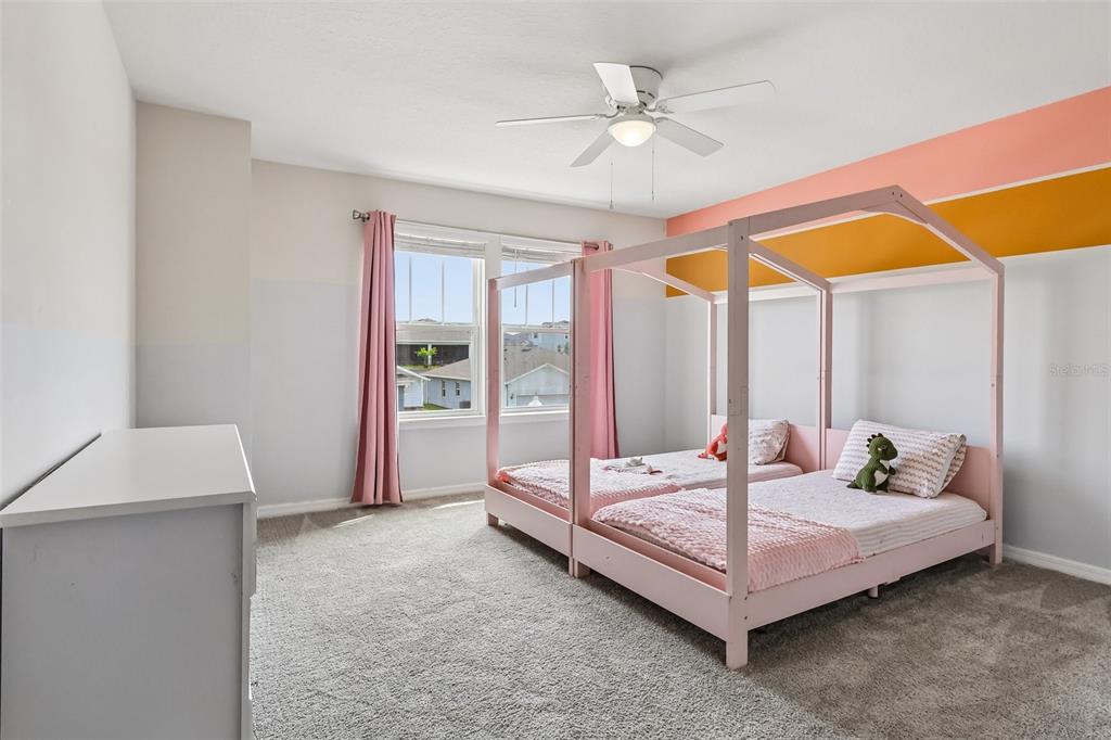 2575 Auburn Ridge Drive Apopka, FL 32712 - Photo 26 of 48 a spacious bedroom with a bed and a window