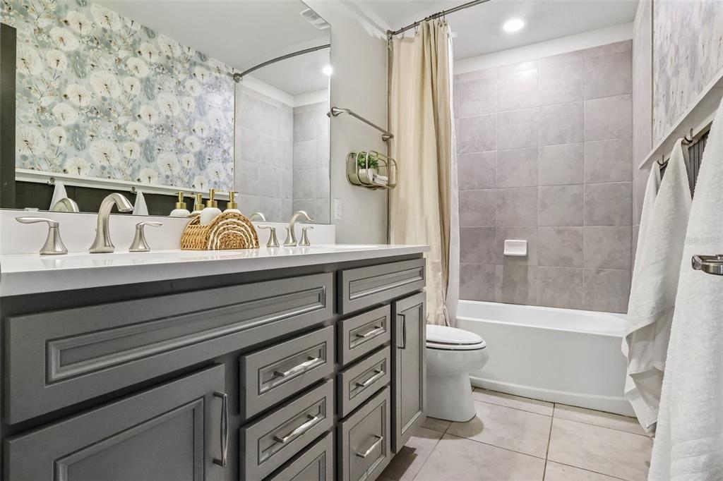 2575 Auburn Ridge Drive Apopka, FL 32712 - Photo 27 of 48 a bathroom with a sink a toilet and shower