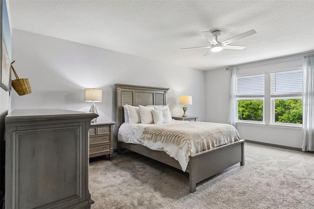 2575 Auburn Ridge Drive Apopka, FL 32712 - Photo 28 of 48 a spacious bedroom with a bed and a window