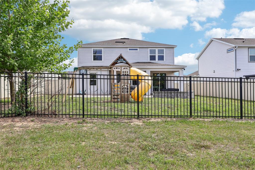 2575 Auburn Ridge Drive Apopka, FL 32712 - Photo 38 of 48 a view of a house with a wooden deck