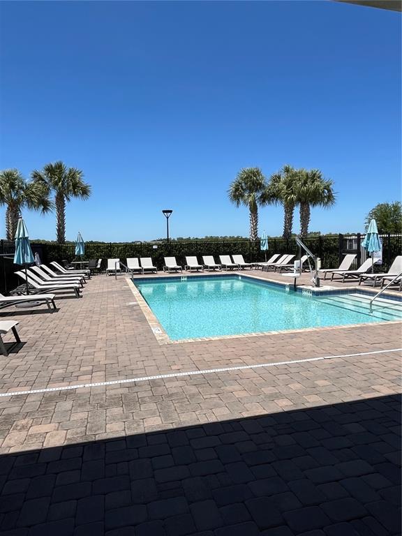 2575 Auburn Ridge Drive Apopka, FL 32712 - Photo 47 of 48 an outdoor space with lounge chair