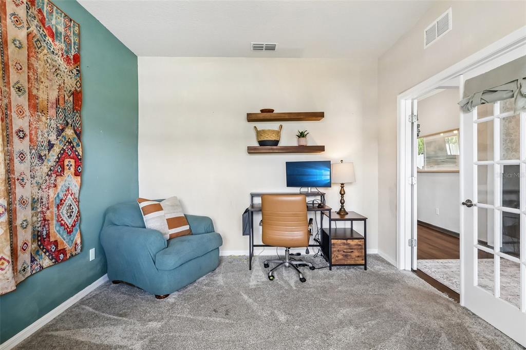 2575 Auburn Ridge Drive Apopka, FL 32712 - Photo 7 of 48 a living room with furniture and a window