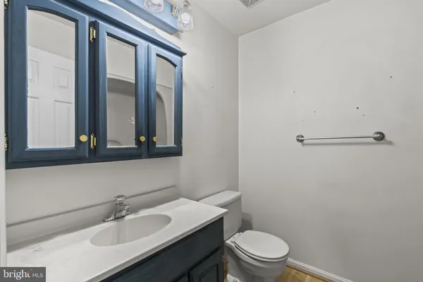 a room with a window and a dresser