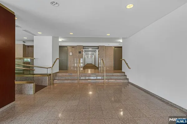 a view of water heater room with stairs