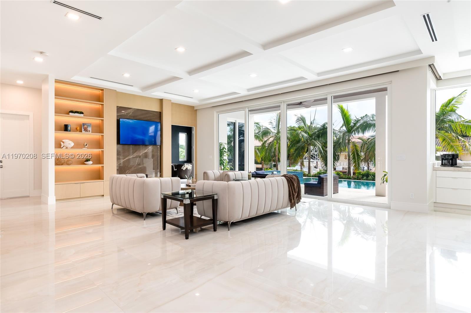 3740 Northeast 29th Avenue Lighthouse Point, FL 33064 - Photo 13 of 50 a living room with furniture and large windows