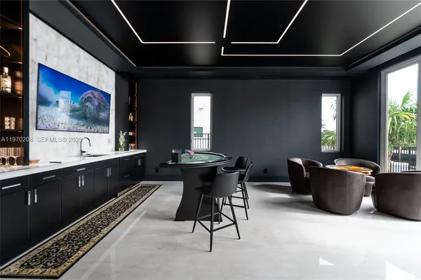 a living room with furniture a window and a table