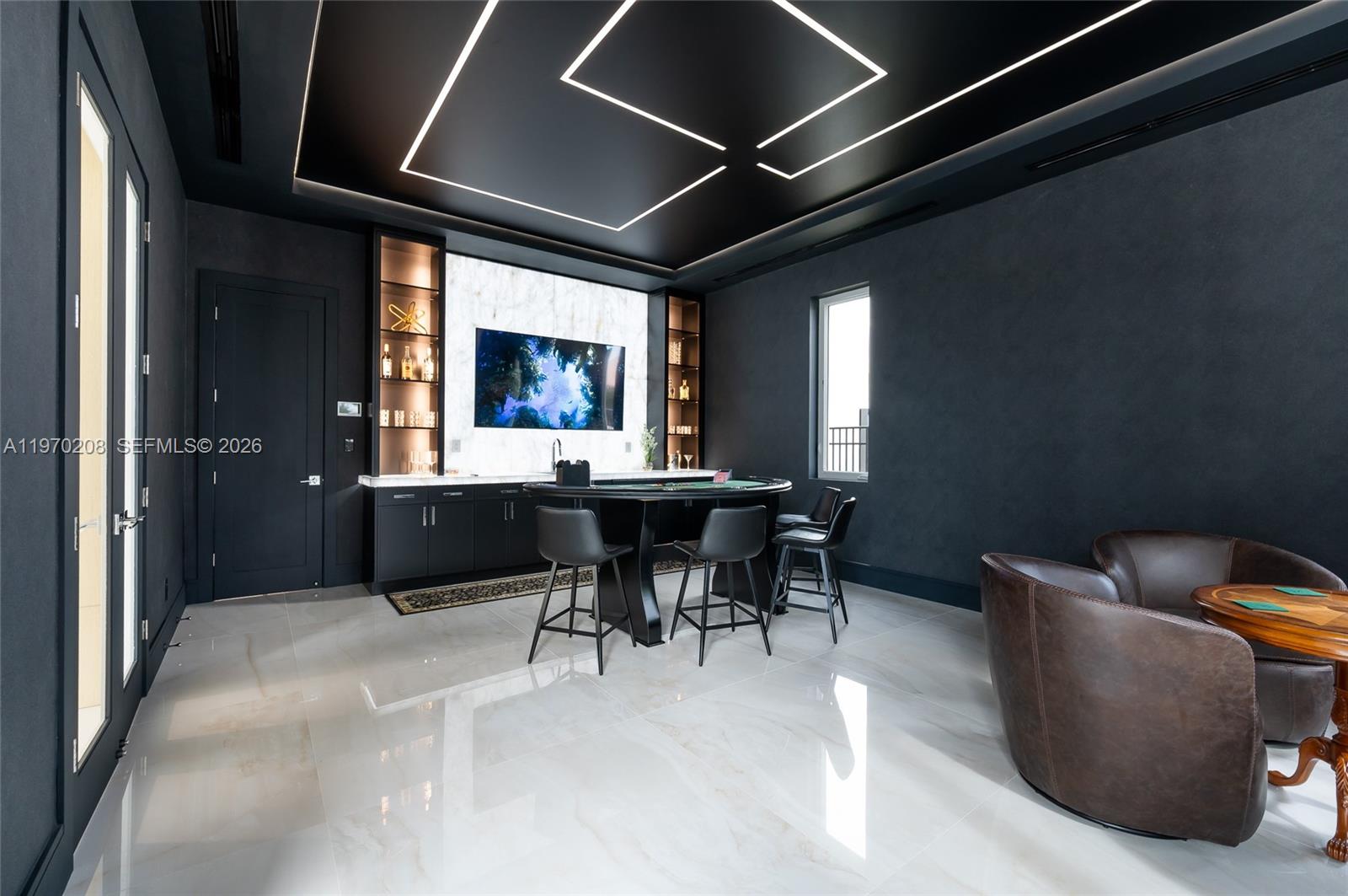 3740 Northeast 29th Avenue Lighthouse Point, FL 33064 - Photo 17 of 50 a living room with furniture a window and a table