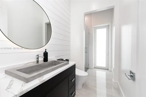 a work room with furniture and large window