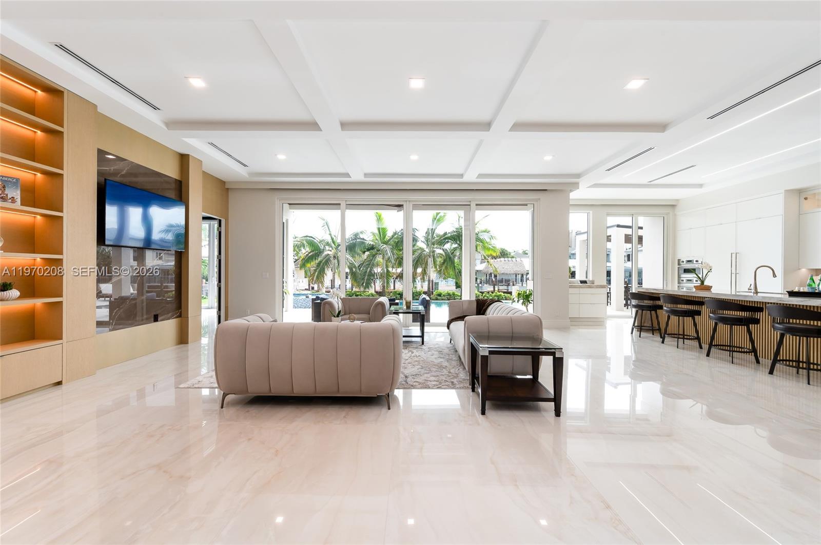 3740 Northeast 29th Avenue Lighthouse Point, FL 33064 - Photo 2 of 50 a living room with furniture and large windows