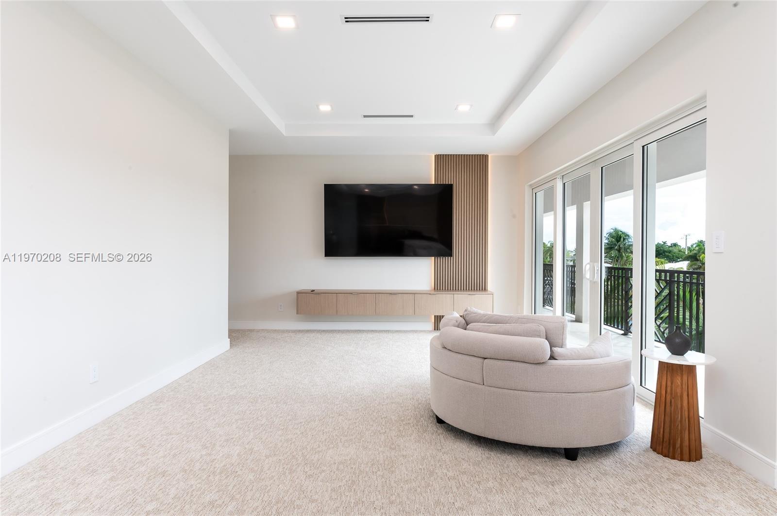 3740 Northeast 29th Avenue Lighthouse Point, FL 33064 - Photo 27 of 50 a living room with furniture and a flat screen tv