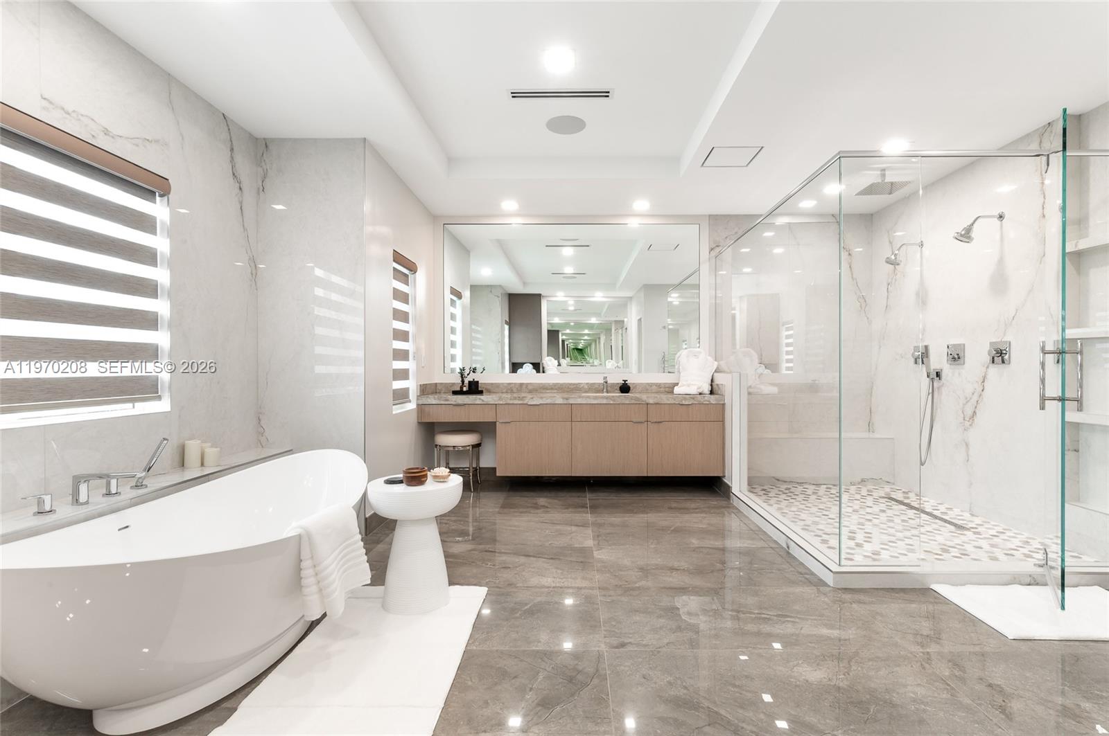 3740 Northeast 29th Avenue Lighthouse Point, FL 33064 - Photo 32 of 50 a bathroom with a sink a toilet and shower