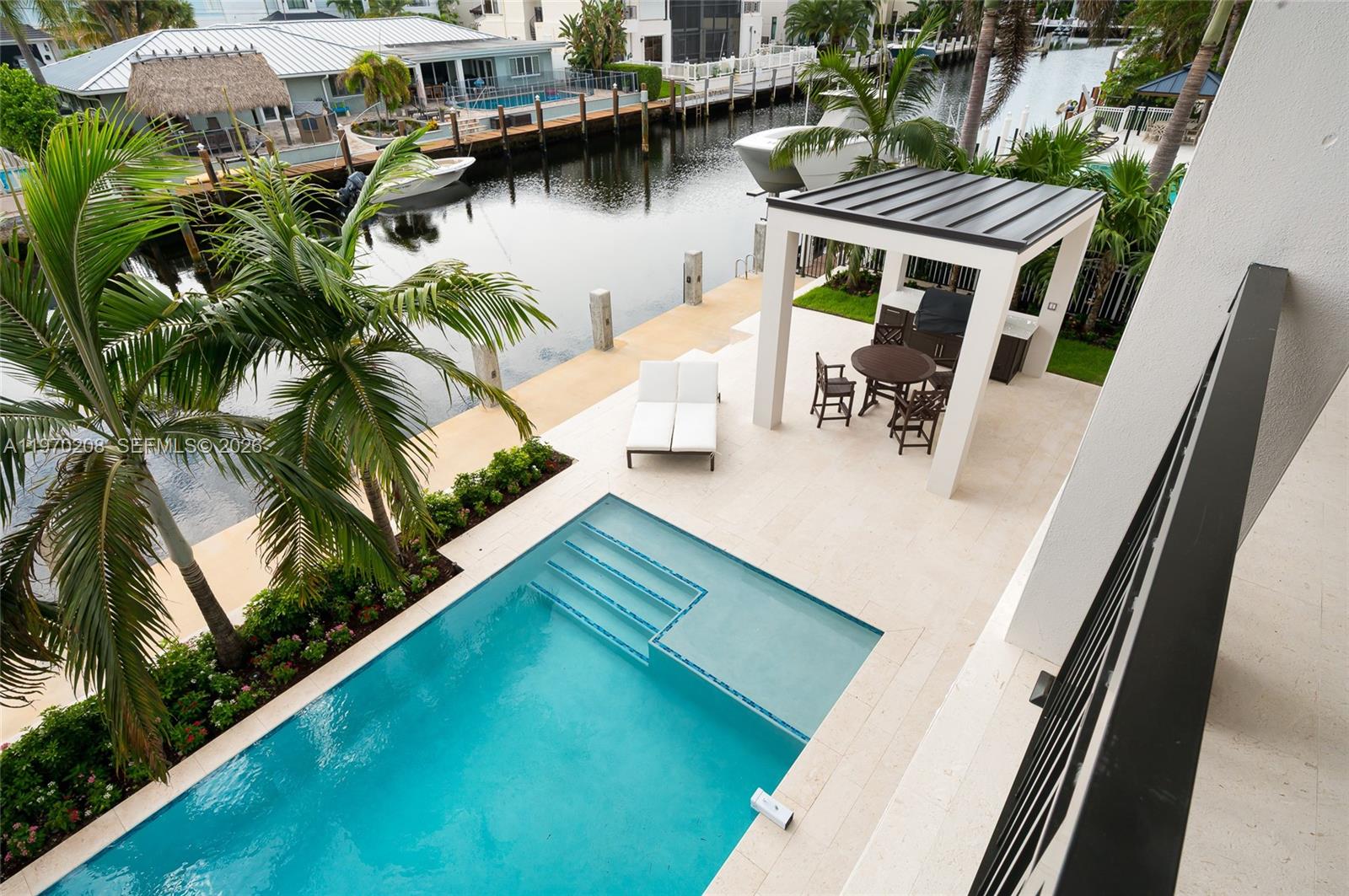 3740 Northeast 29th Avenue Lighthouse Point, FL 33064 - Photo 41 of 50 a view of swimming pool with chairs