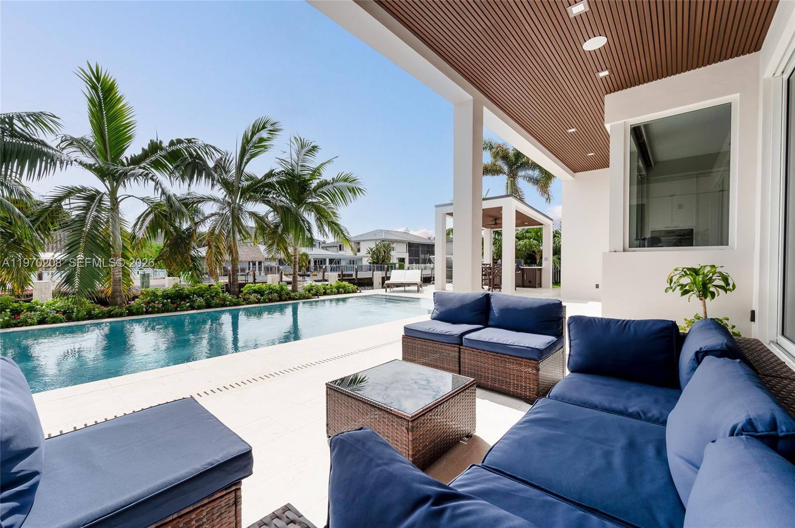 3740 Northeast 29th Avenue Lighthouse Point, FL 33064 - Photo 42 of 50 a living room with furniture and a potted plant