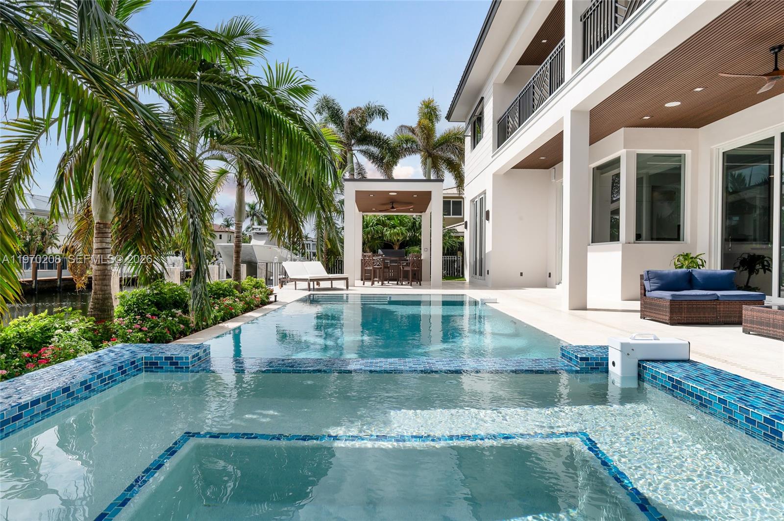 3740 Northeast 29th Avenue Lighthouse Point, FL 33064 - Photo 43 of 50 a view of a patio with couches and potted plants