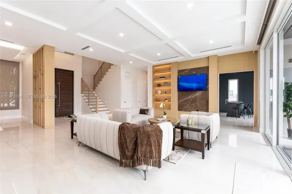 a living room with furniture and a large window