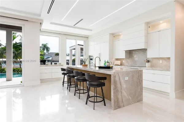 a view of kitchen with furniture and white walls
