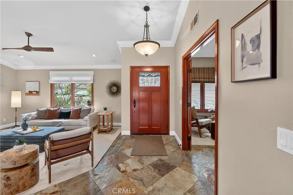 a spacious bathroom with a double vanity sink toilet mirror and shower