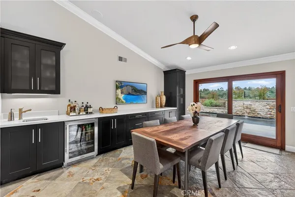 a bathroom with a sink a toilet and a large mirror