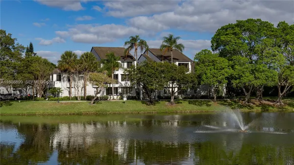 a view of a lake with a building in the background