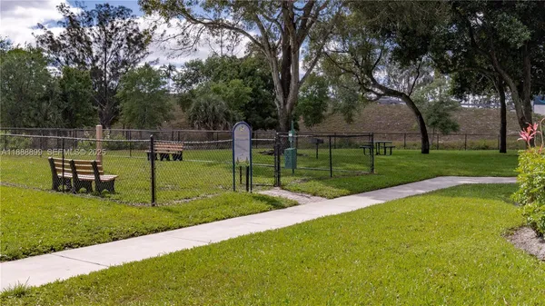 a view of a backyard with sitting area