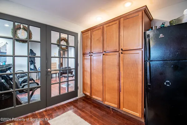 a view of a refrigerator and window in a room